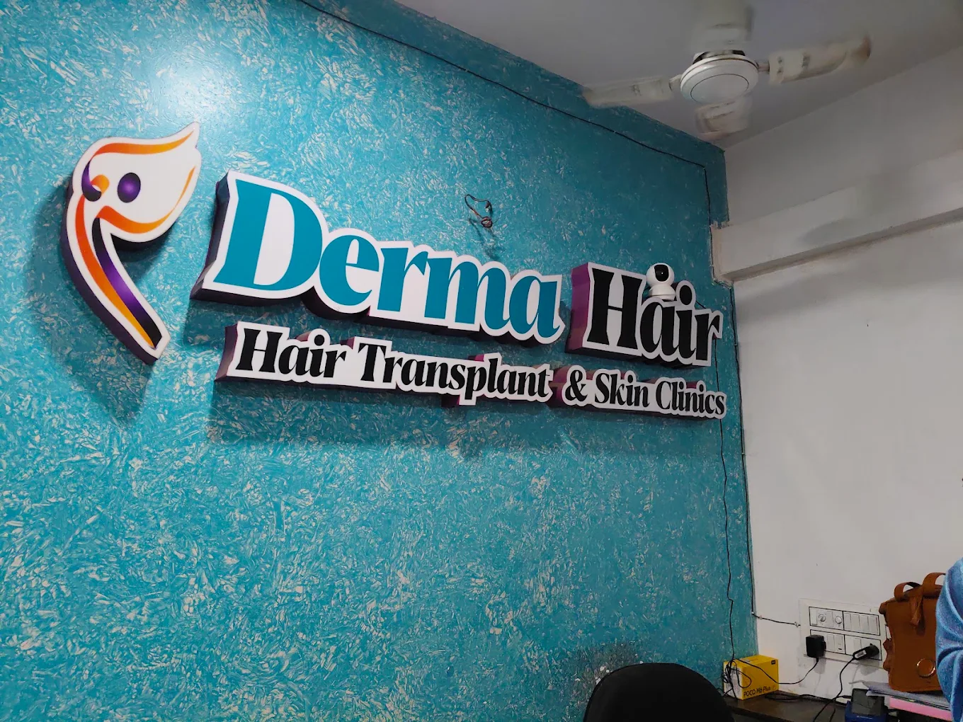 Derma Hair Transplant and Skin Clinics signage inside the Visakhapatnam clinic